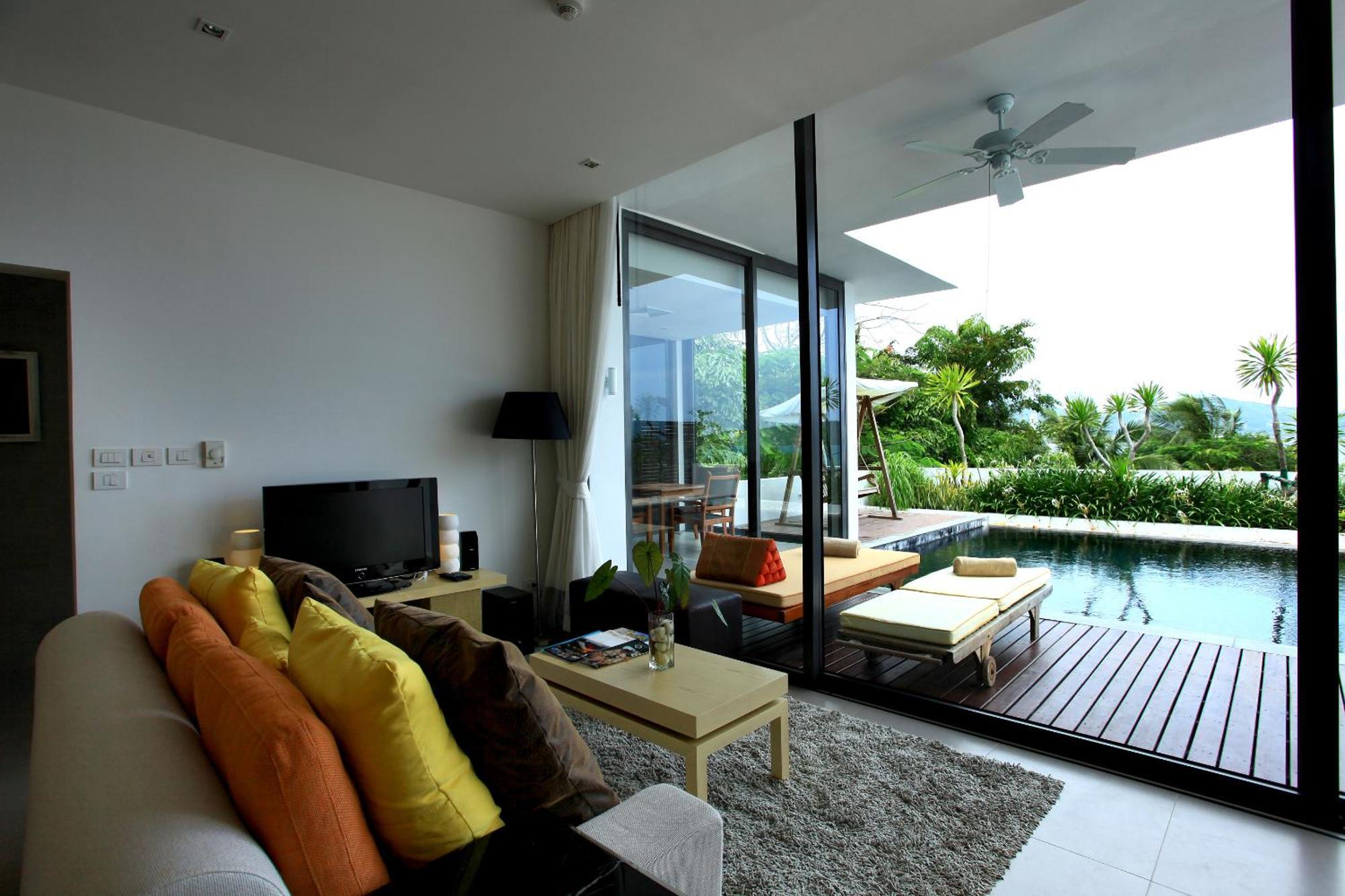 Indochine Resort And Villas - Sha Extra Plus Patong Exteriér fotografie A living room with a view of the pool